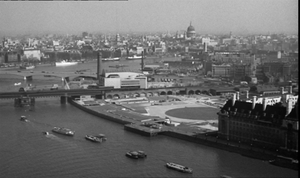 A shot perhaps from Elizabeth Tower of the South Bank showing the site of The Festival of Britain, The Royal Festival Hall with County Hall bottom right. Circa 1961