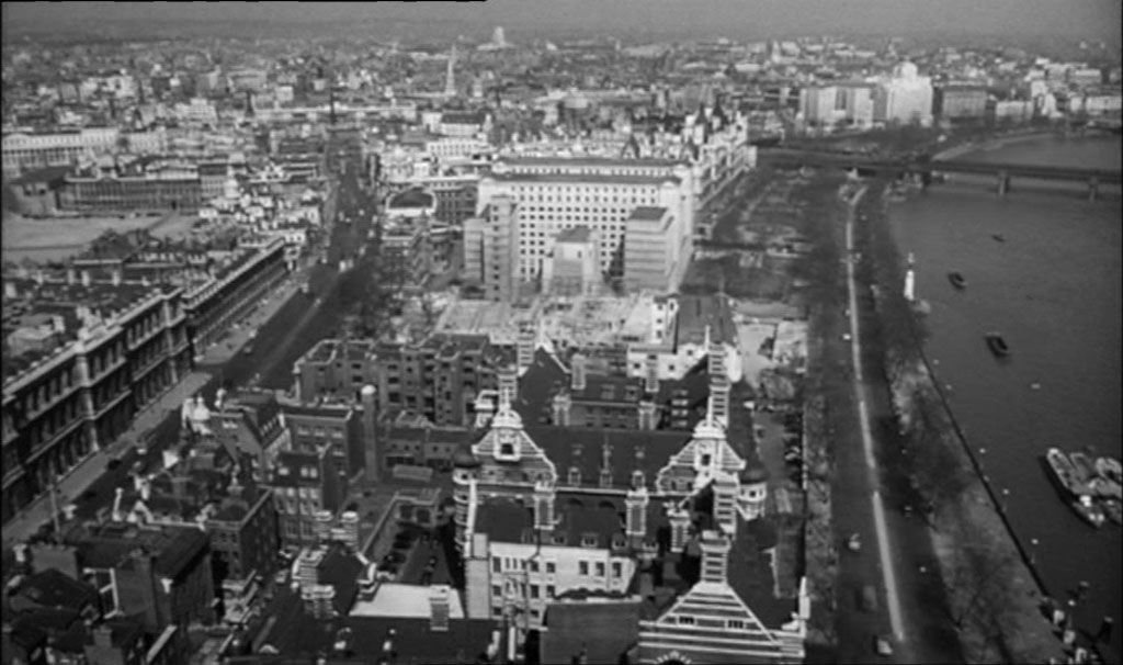 An aerial view, perhaps from the Elizabeth Tower looking north over Scotland Yard towards the white building of the Ministry of Defence. Circa 1961