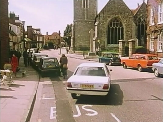 Looking west up the High Street, Lymington to St. Thomas the Apostle church. Circa 1980