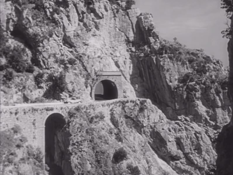 Strada Statale 163 Amalfitana, just leaving the short tunnel above the gorge at the Marina di Praia, to be found east of Praiano. Circa 1953