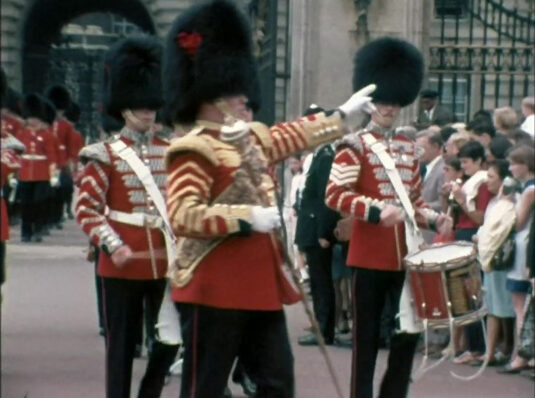 Exiting Buckingham Palace. Circa 1968