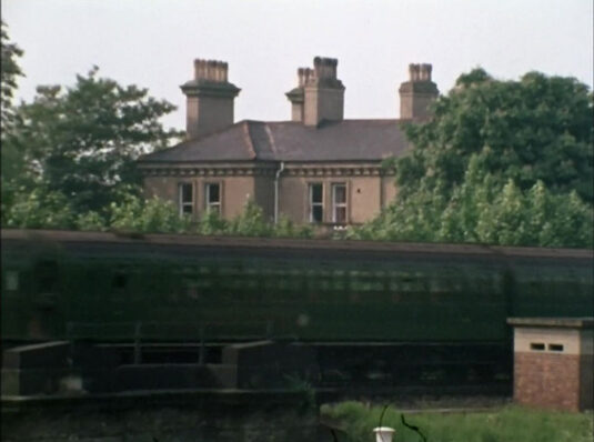 The Elms, Ducks Walk, Twickenham with passing train in front. Circa 1968