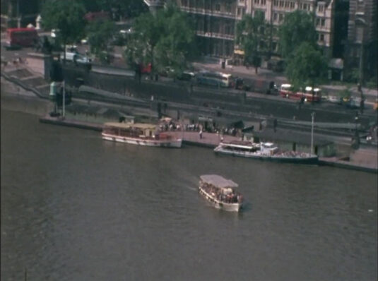 Westminster Pier with the Victoria Embankment, SW1 behind and the London bus having just crossed Westminster Bridge. Circa 1968
