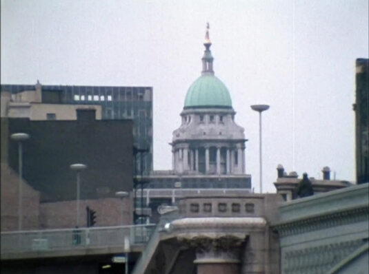 Approaching Blackfriars Bridge the green dome of the Old Bailey can be seen. Circa 1968