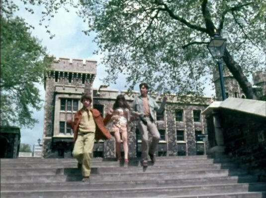 The Tower of London. The Flint Tower behind them to the left and the Bowyer Tower to their right. Circa 1968