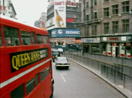 Piccadilly and the entrance to the Haymarket below the BOAC sign. Circa 1968