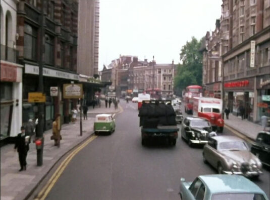 Kensington High Street with Kensington Church Street, W8 off by those trees. Circa 1968