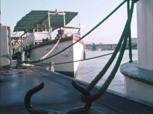 Westminster Pier and a view down the Thames to Hungerford Bridge and Waterloo Bridge beyond. Circa 1968