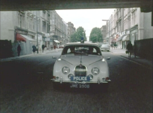 Ladbroke Road under the bridges of Ladbroke Grove Station. Circa 1968