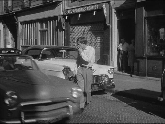 The bystanders are at 11 Rue Campagne-Première. Circa 1960