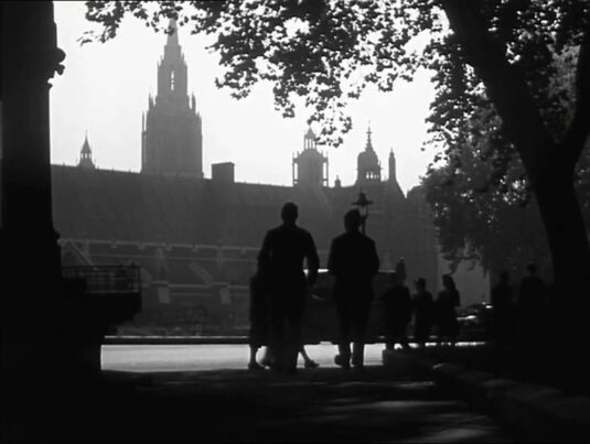 The Houses of Parliament as seen from across Parliament Square. The column seen in the left of the capture is part of the Buxton Memorial Fountain that stood on the site currently occupied by the statue of George Canning. Circa 1942