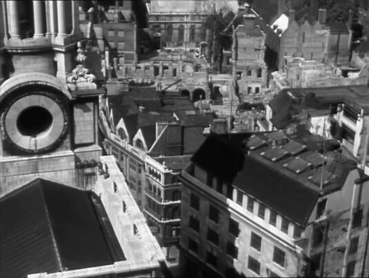 The northern side of St. Paul’s Cathedral looking down to properties on St Paul’s Church Yard and London House Yard dividing the two buildings. Circa 1942