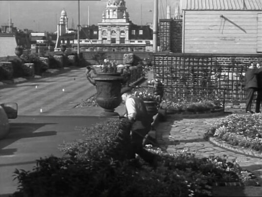 A pan shot continues and stops here with 68 King William Street prominent. Circa 1942