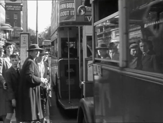 Park Lane looking south, reflections would suggest that the bus stop in 1942 was the same as today. Circa 1942