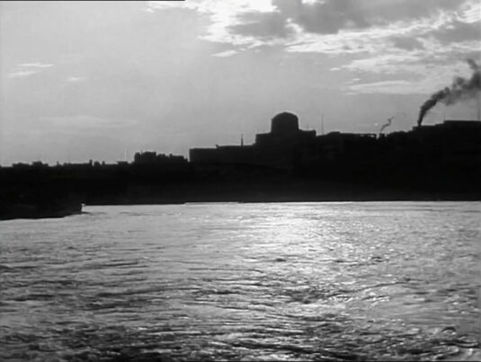 A view across the River Thames with what sure surely is the profile of 80 Strand (formerly Shell Mex House) on the north bank. Circa 1942
