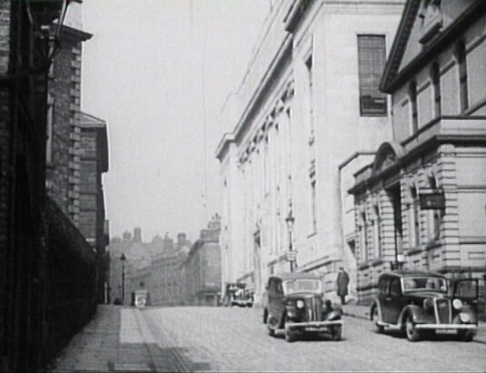 Surrey Street, S1 looking north with the white Sheffield Central Library on the brow of the hill. Circa 1942
