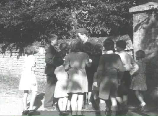 Outside the entrance gate to All Saints’ Church, Sutton Courtenay, Oxfordshire. Circa 1943