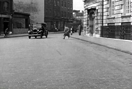 Minories, EC3 with 85-88 on the right and 96 to 99 to the right of the ruin. Circa 1949