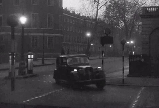 On the right, the porticoed entrance of 24 Russell Square with its entrance in Thornhaugh Street. On the left is The School of Oriental and African Studies, University of London, and beyond it Woburn Square. Which, of course, makes Russell Square Gardens WC1 behind the camera. Circa 1949