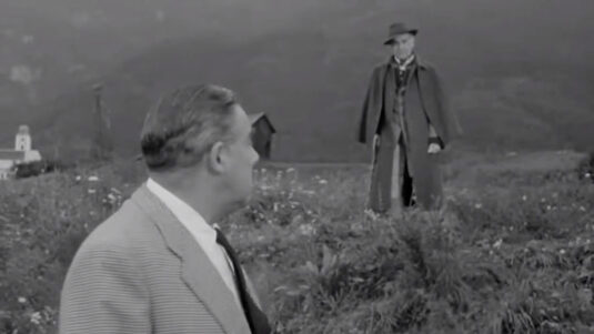 On the far left in the background, the Expositure Church of St. Magdalene and St. Nicholas at Karrösten village Circa 1955