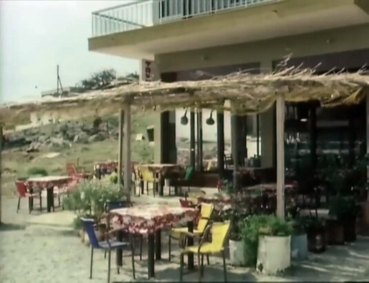 It was called the 'Taverna Vassilis', but now 'Ferryman Taverna'. Circa 1977