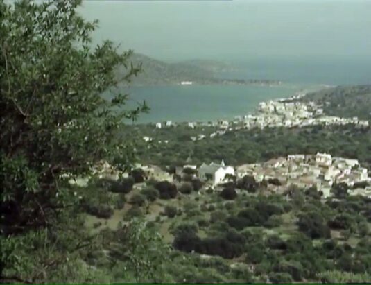 Elounda comes into their view. Filmed from the Fourni to Elounda road, above Upper Elounda. Circa 1977