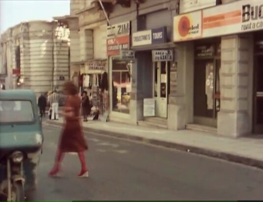The building on the left is the Bank of Greece and is still there. 25th August Street in Heraklion. Circa 1977