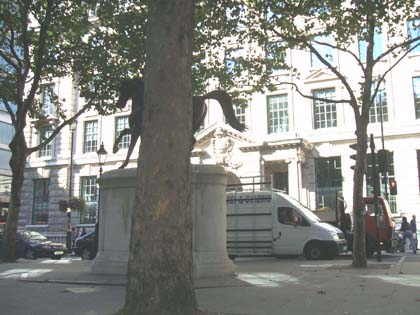 The corner of Cockspur Street and Pall Mall East, London SW1 with the statue of King George lll.