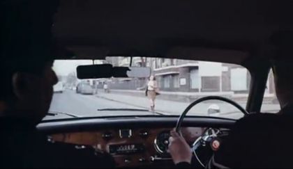 the view north along Bramley Road, W10. The woman, in the grab from the film, is in front of Bramley House which is on the corner (at right) of Blechynden Street. Circa 1967