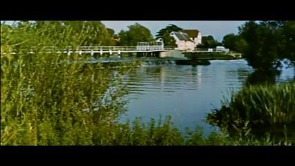 Hambleden Weir in Berkshire with Hambleden Mill in the right of centre background. Circa 1956
