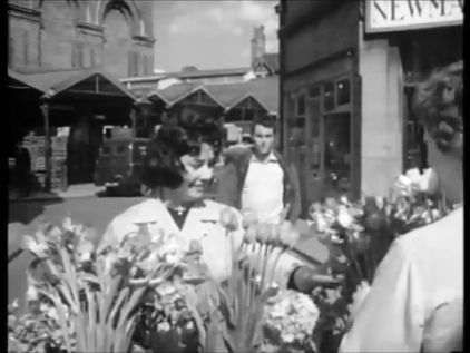 Cornhill, Lincoln facing Sincil Street with the Corn Market rising on the left. Circa 1962